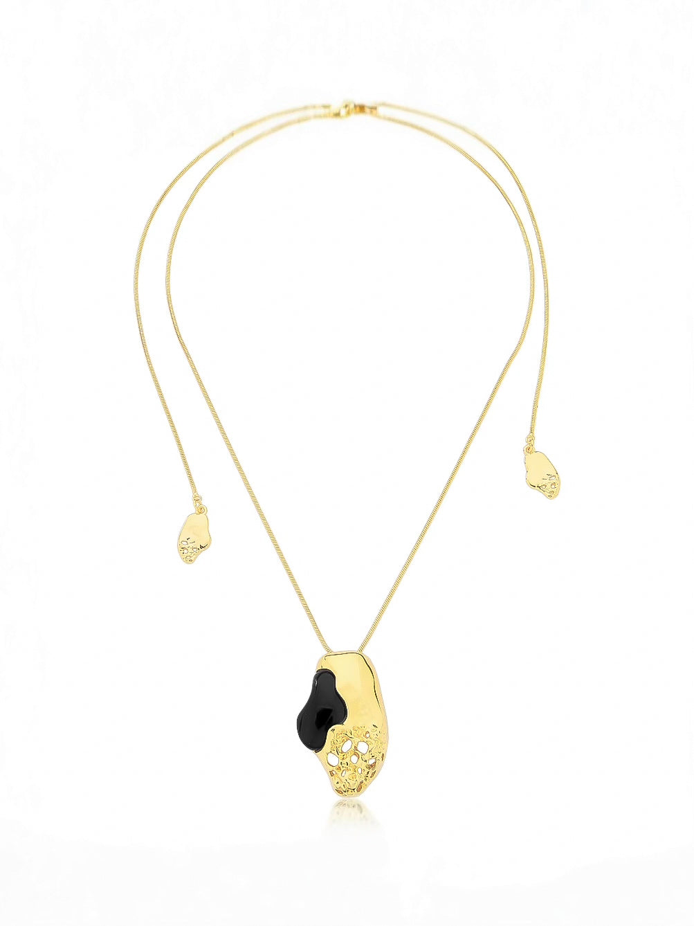 Gold necklace with a black pendant on a white background