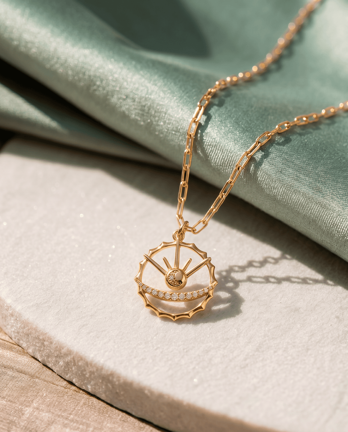Faceted crystal details on the gold plated Azulique Amulet Necklace