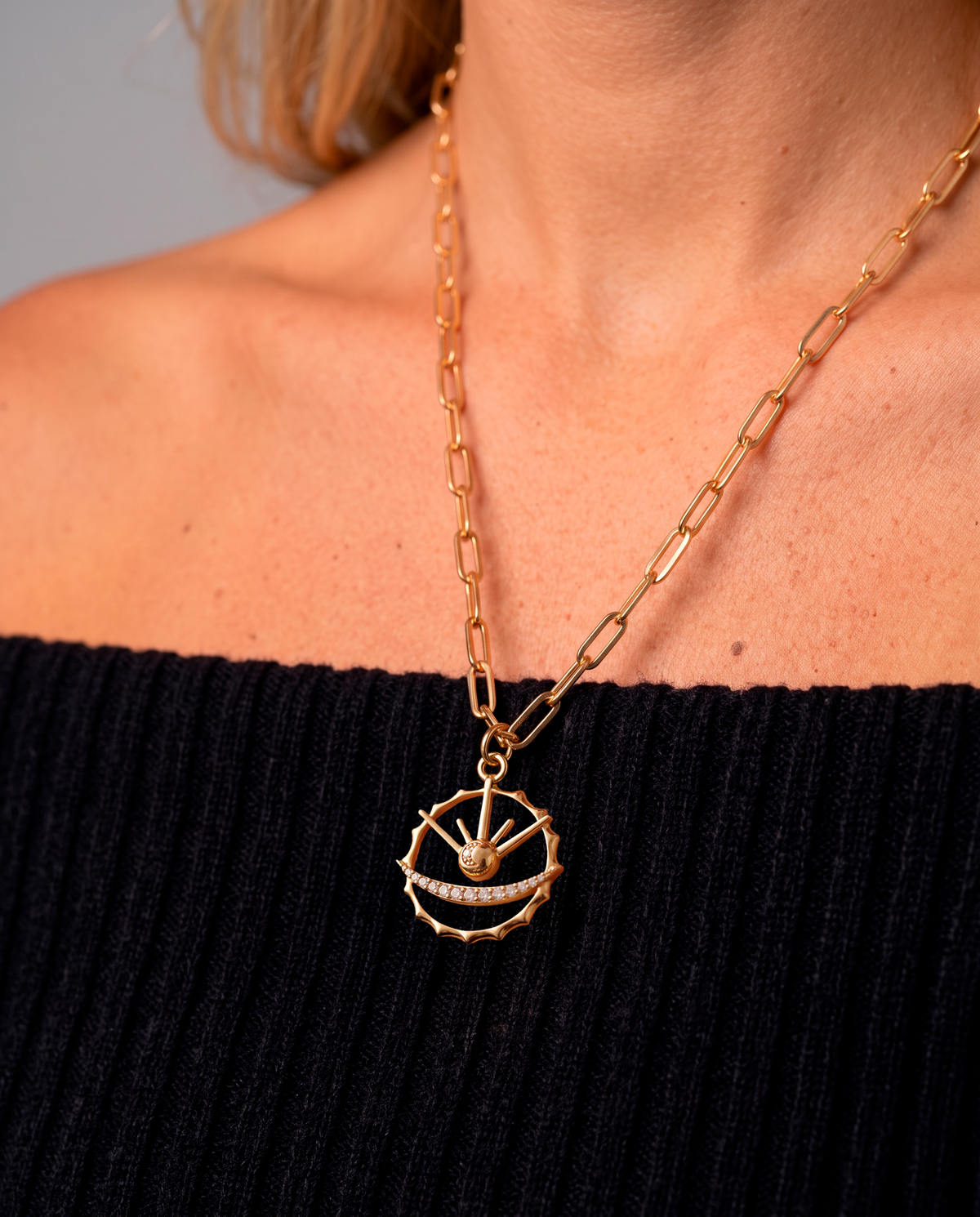 Azulique Amulet Necklace worn on the neckline showing its pendant scale