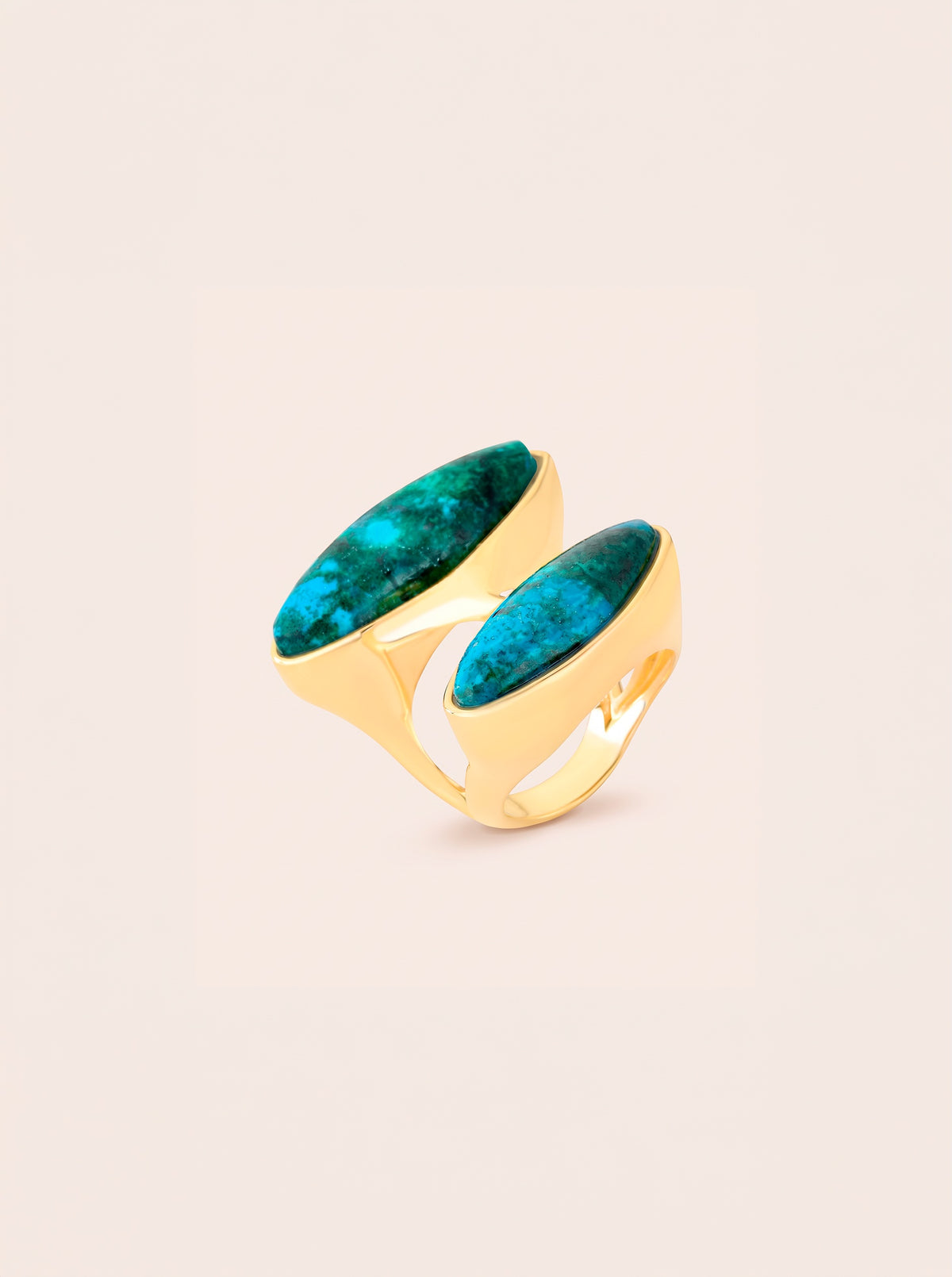 Duet ring with two elongated blue-green chrysocolla stones in an offset arrangement, framed by gold-toned contours.