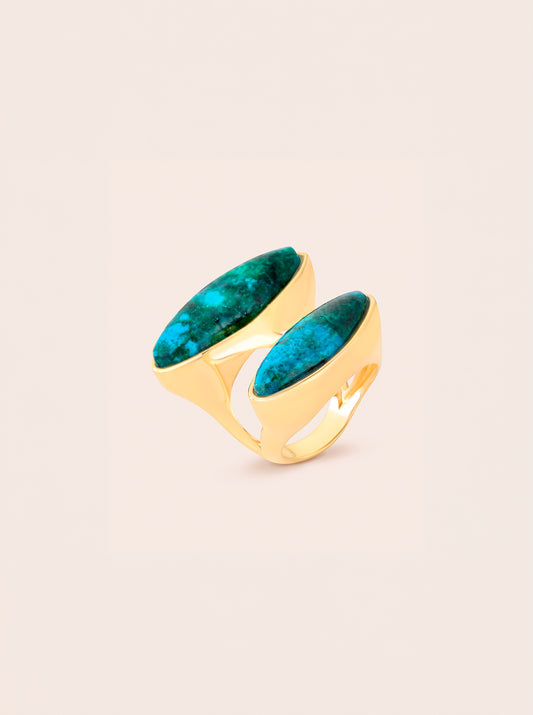 Duet ring with two elongated blue-green chrysocolla stones in an offset arrangement, framed by gold-toned contours.