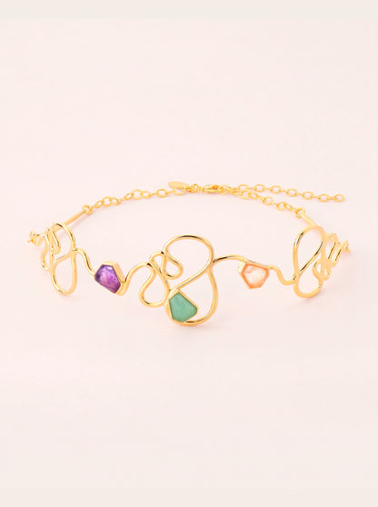 Ginga Soft Choker necklace with flowing gold-toned curves, amethyst, green quartz and rose quartz.