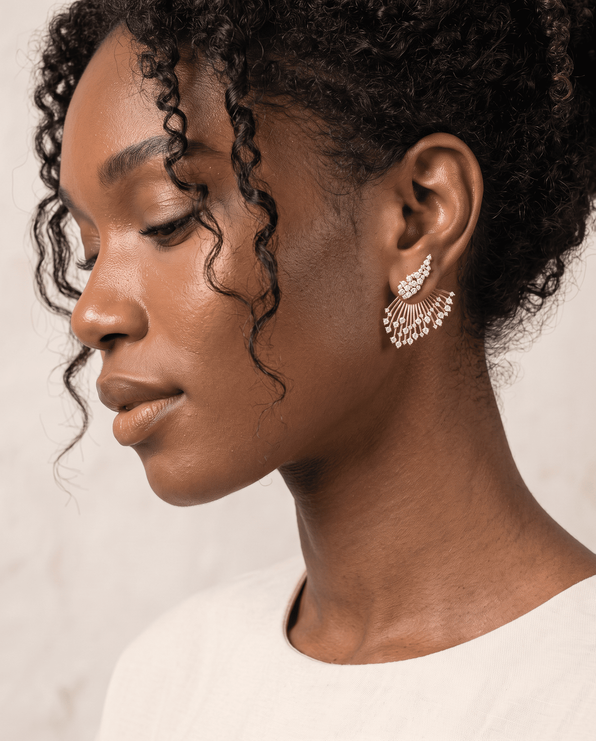 woman wearing Cut crystal ear jacket earrings with 18k gold-plated finish, Art Deco Line by Azulique
