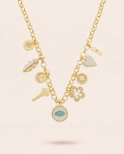 Azulique Divinity charm necklace with a gold finish, celestial medallions and a central cream pendant featuring a blue evil eye.