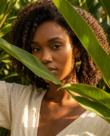 Model wearing  labradorite statement earrings with 18k gold-plated finish, Selva Line by Azulique.