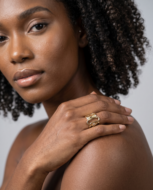 Gold wide openwork statement ring with curved loops and pavé crystal details worn 