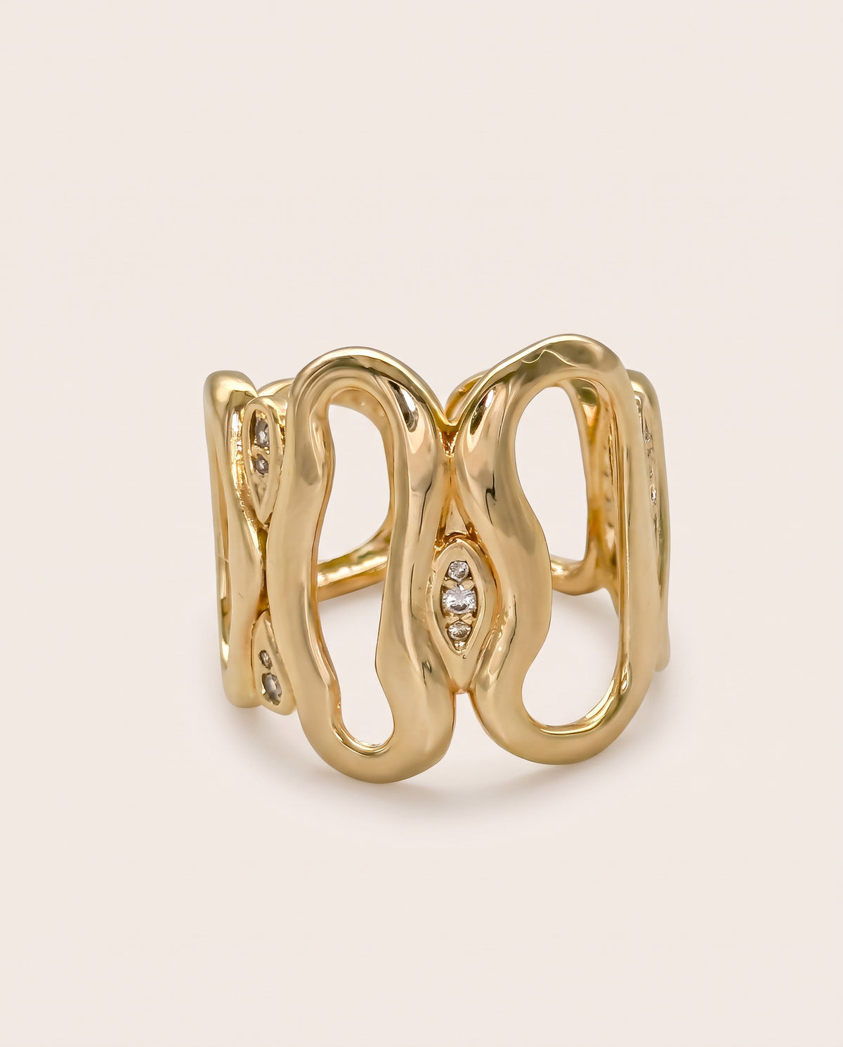 Gold wide openwork statement ring with curved loops and pavé crystal 