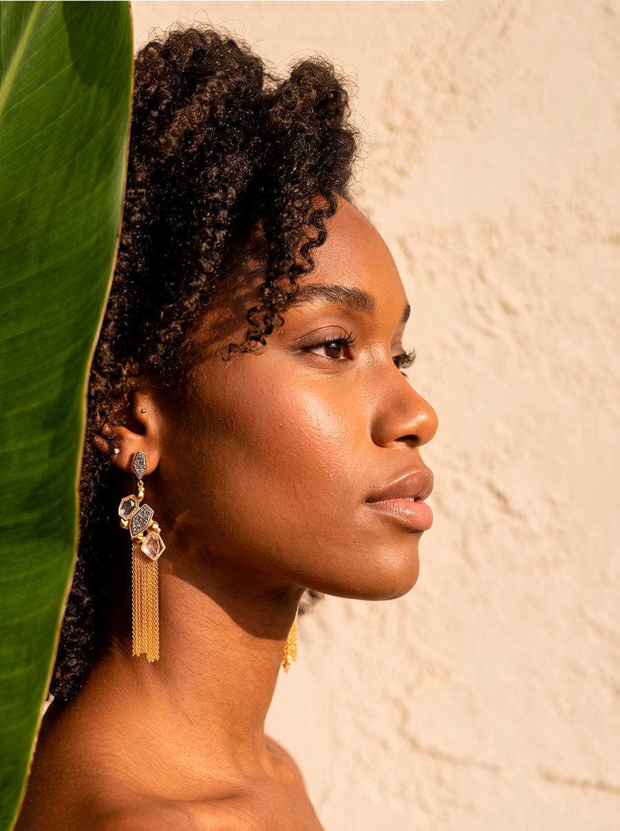 Woman wearing a Natural crystal druzy statement earrings with 18k gold-plated finish, Selva Line by Azulique.
